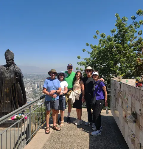 US travelers enjoying a private tour at the Pope John Paul II monument in Santiago