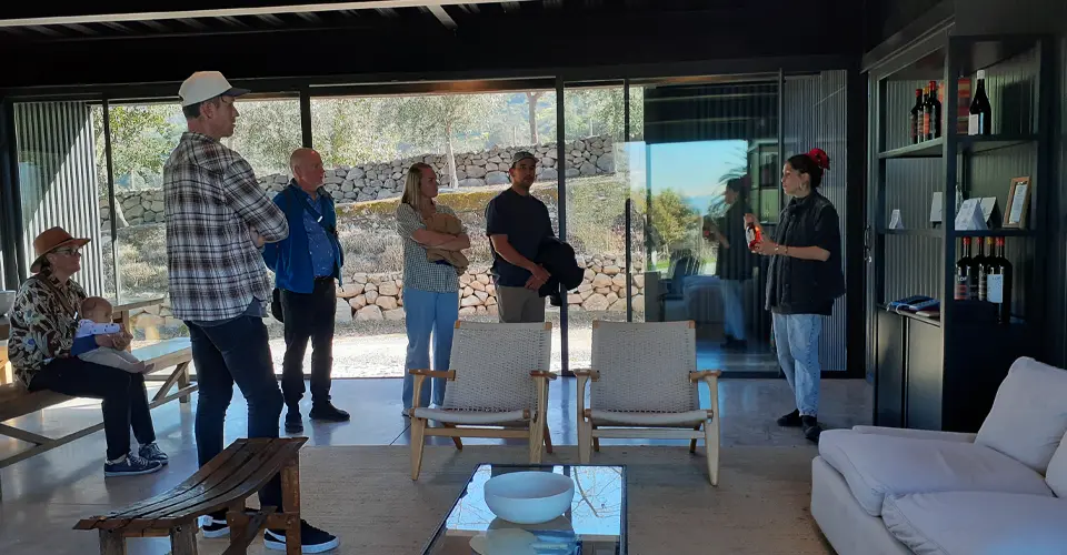 A group of travelers enjoying a premium wine tasting in Miapo valley