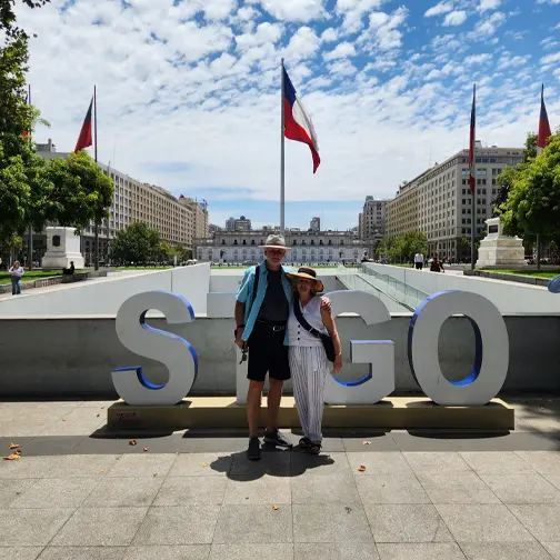 Senior couple enjoying a private city tour near La Moneda Palace in Santiago