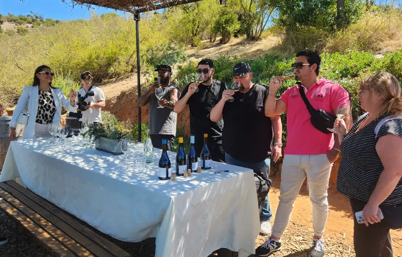 Travelers enjoying a premium wine tasting in a chilean vineyard